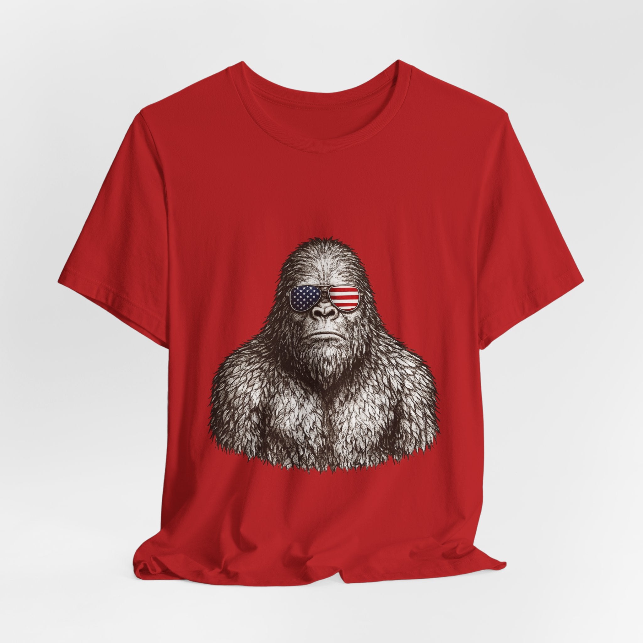 Patriotic Sasquatch Tee — Bigfoot Wearing American Flag Sunglasses