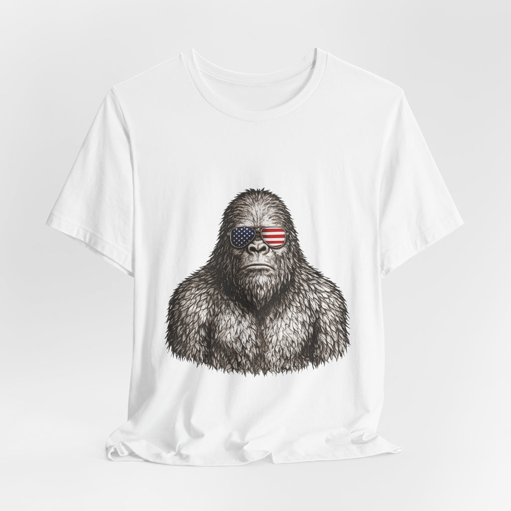 Patriotic Sasquatch Tee — Bigfoot Wearing American Flag Sunglasses