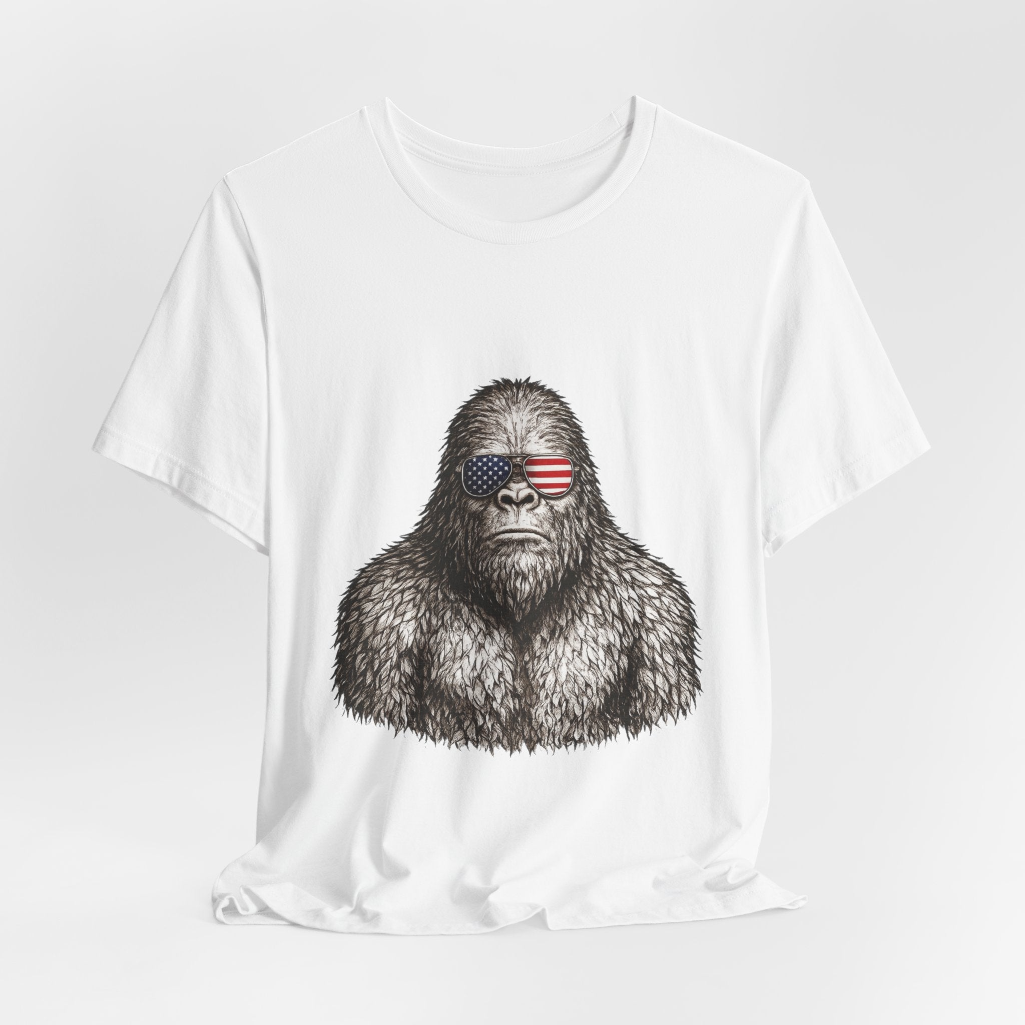 Patriotic Sasquatch Tee — Bigfoot Wearing American Flag Sunglasses