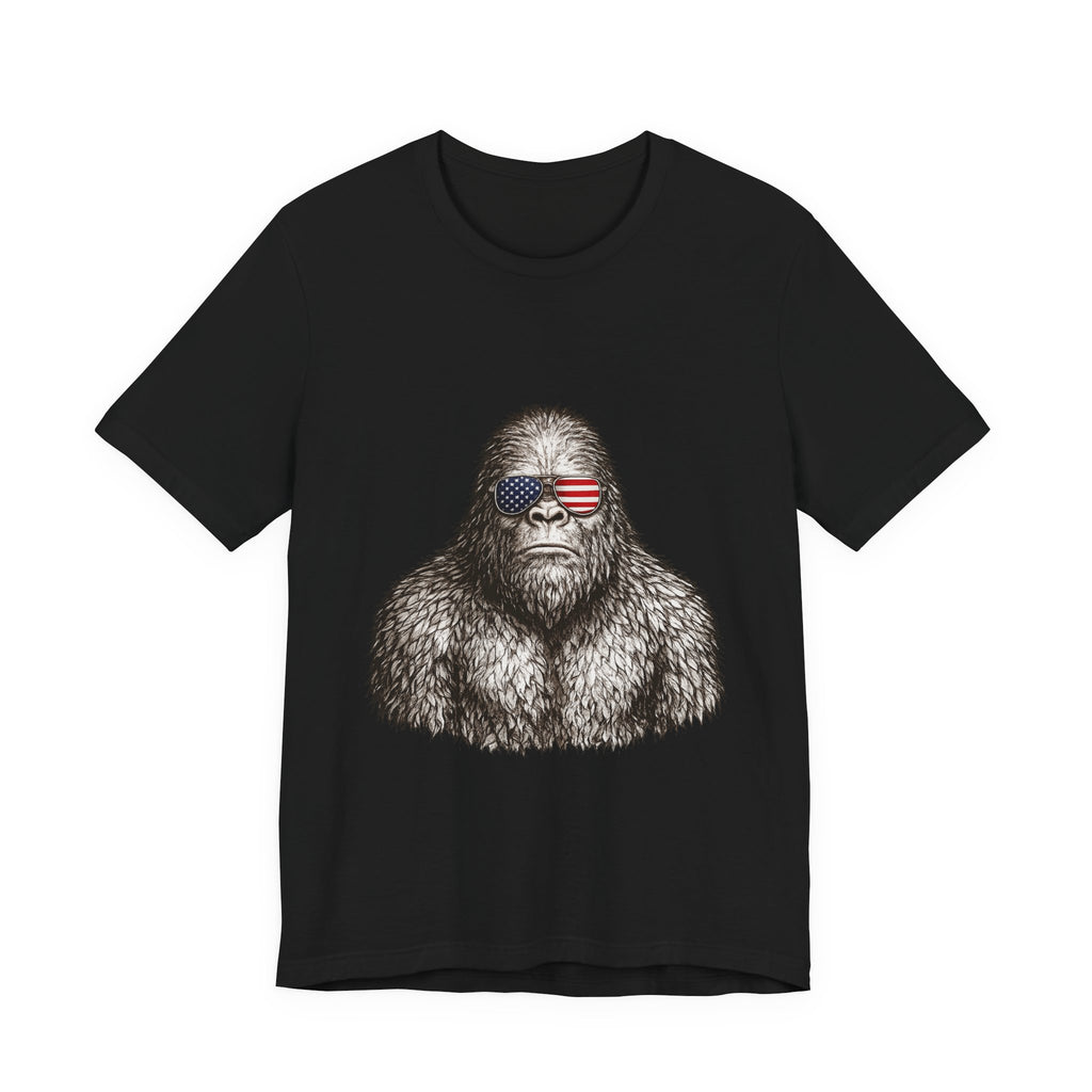 Patriotic Sasquatch Tee — Bigfoot Wearing American Flag Sunglasses