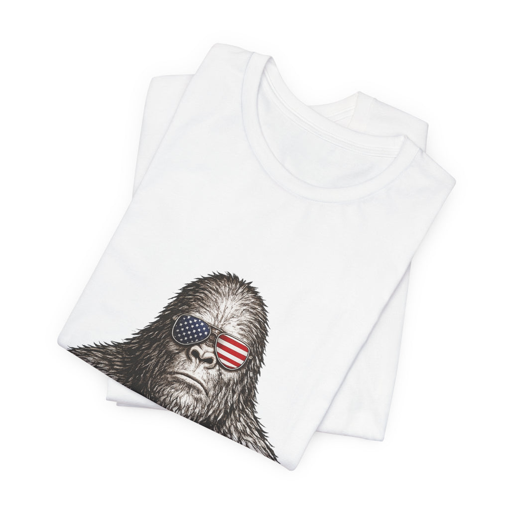 Patriotic Sasquatch Tee — Bigfoot Wearing American Flag Sunglasses