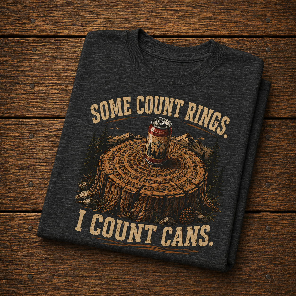 Camping Humor T-Shirt — “Some Count Rings, I Count Cans” Beer Can Tree Stump Tee