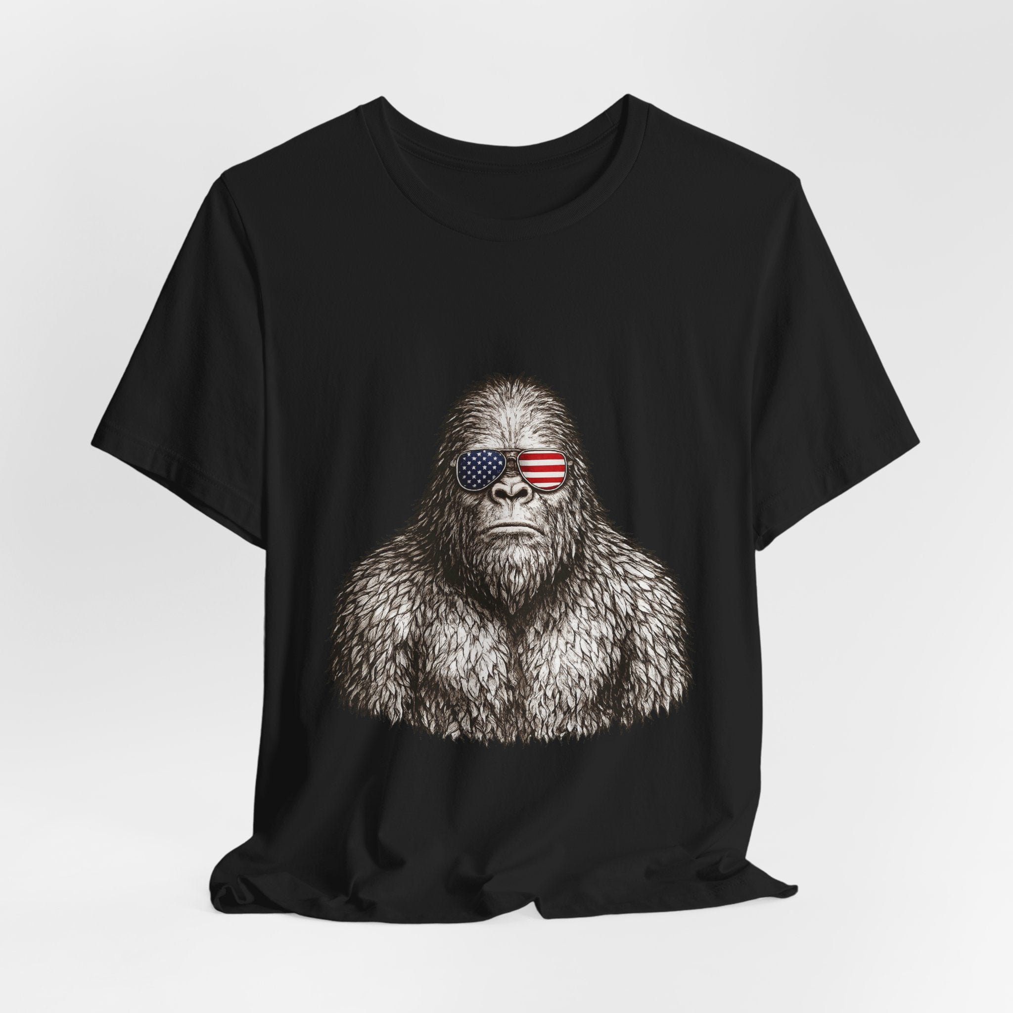 Patriotic Sasquatch Tee — Bigfoot Wearing American Flag Sunglasses