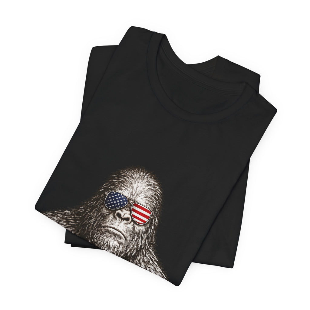 Patriotic Sasquatch Tee — Bigfoot Wearing American Flag Sunglasses