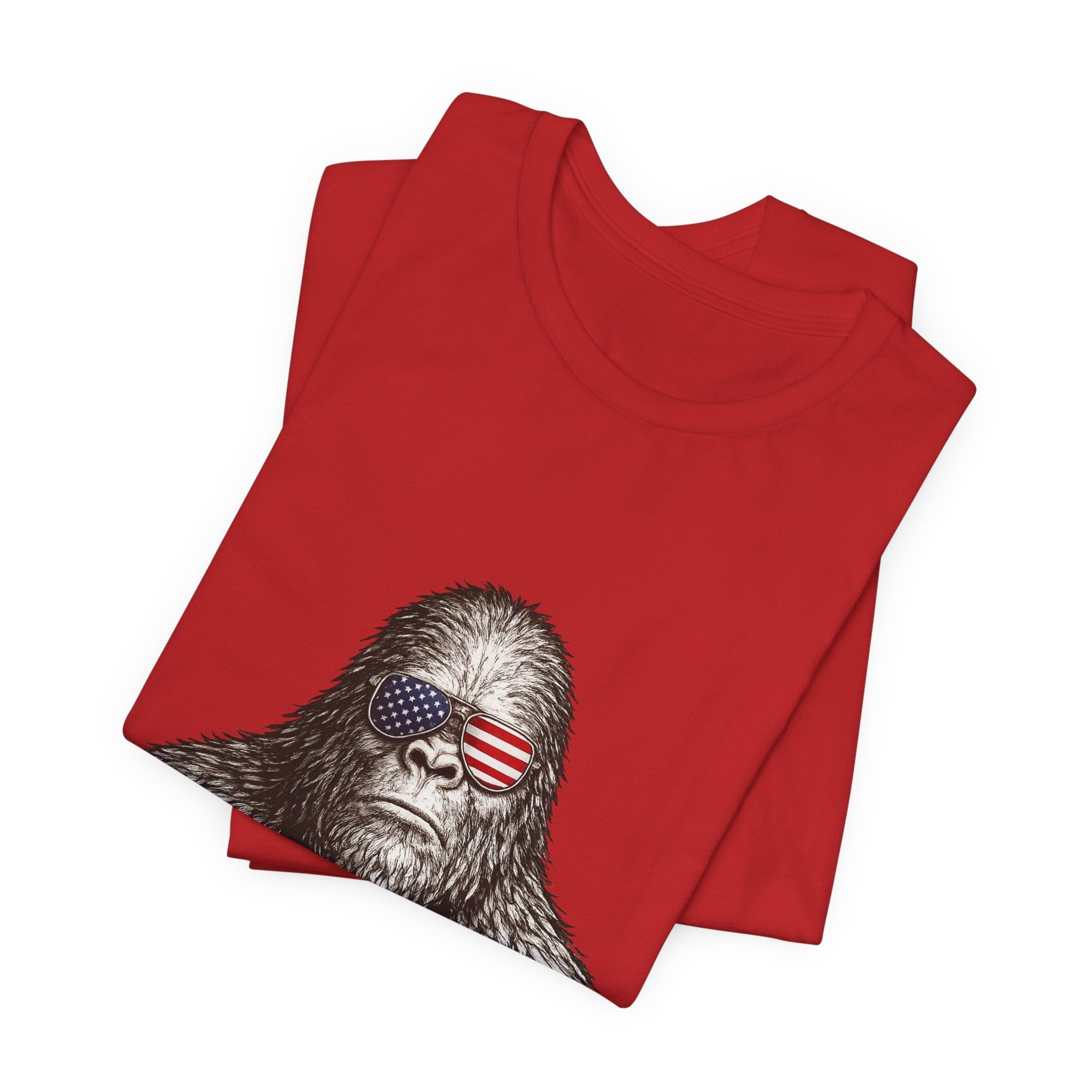 Patriotic Sasquatch Tee — Bigfoot Wearing American Flag Sunglasses